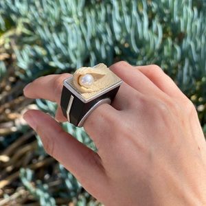 unique ring design is made of iron wood, pearl and white gold